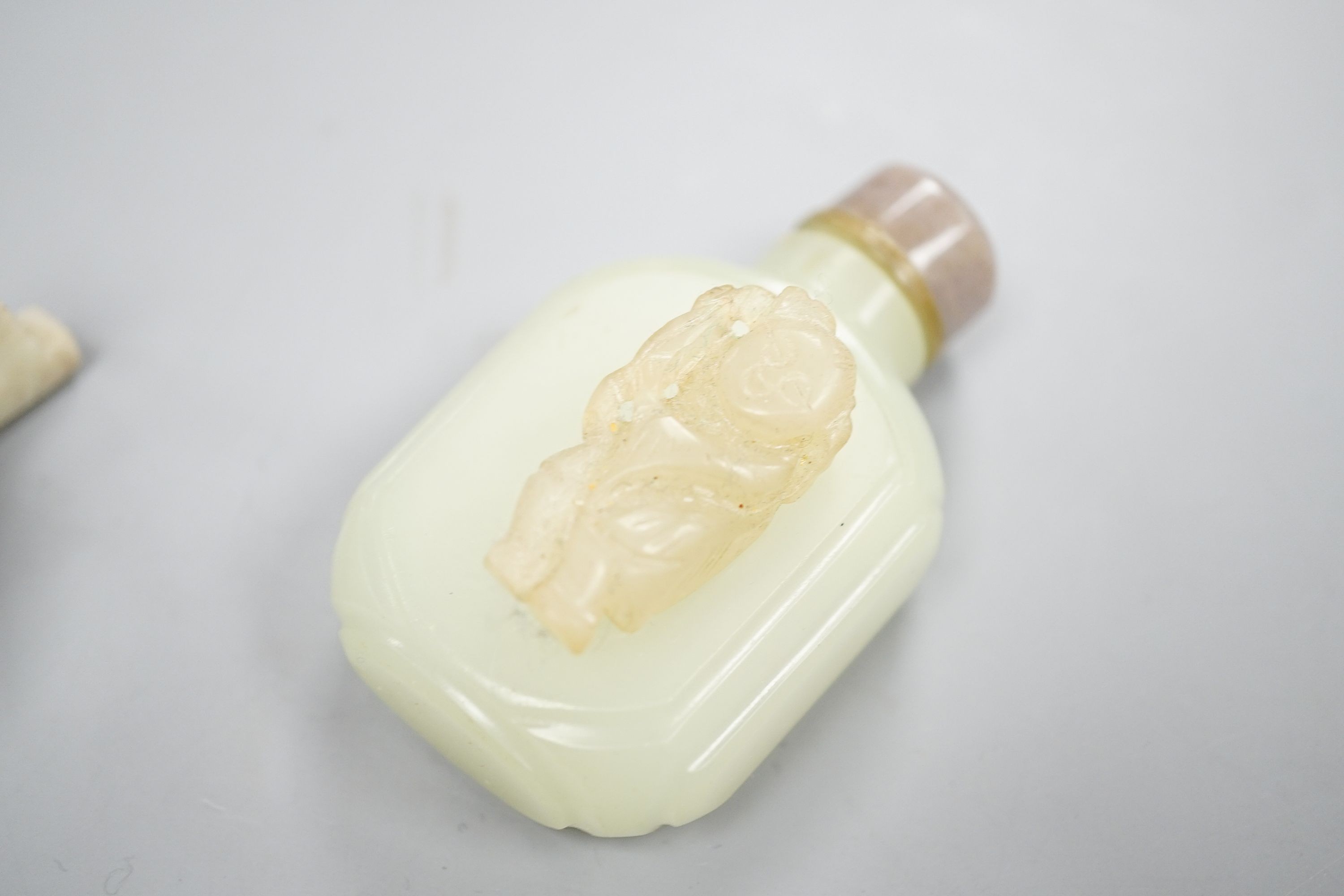 A Chinese jade belt hook, 12.5cm an archer's ring and figure, a stone cup and a glass snuff bottle